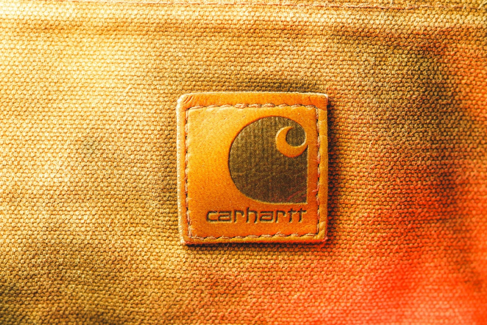 Carhartt logo patch on tan duck canvas